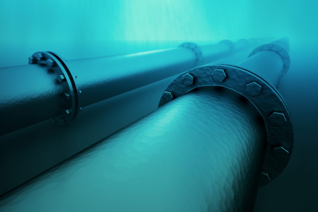 Pipeline beneath the ocean.  Pipeline transportation is most common way of transporting goods such as oil, natural gas or water on long distances.